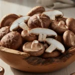 A vibrant, overhead shot of fresh shiitake mushroom calories in a wooden bowl, bathed in soft, natural light, ready for healthy cooking.