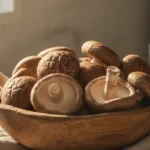 A close-up, artistically arranged bowl of fresh shiitake mushrooms, symbolizing the potential benefits of shiitake mushroom for kidney health.