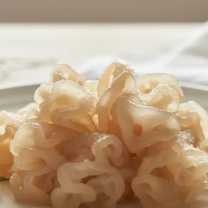 A close-up shot showcasing the delicate, gelatinous structure of tremella mushroom, symbolizing the natural benefits of tremella mushroom for hair health.