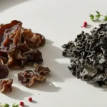 A culinary showcase comparing wood ear mushroom vs black fungus, highlighting their distinct textures and shapes.